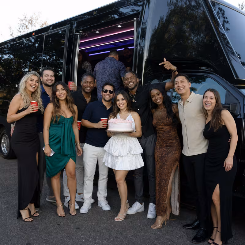 Party bus interior with wraparound leather seating and LED lighting in Dallas