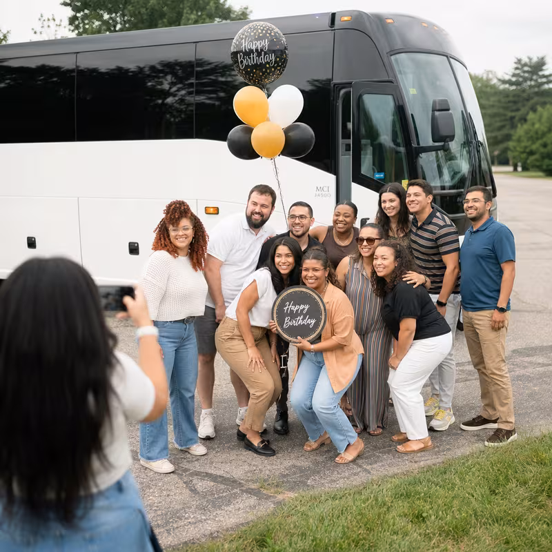 Passengers loading luggage while boarding an Dallas group shuttle