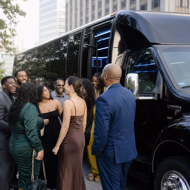Passengers loading luggage while boarding an Dallas group shuttle