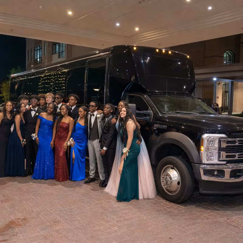 Party bus interior with wraparound leather seating and LED lighting in Dallas