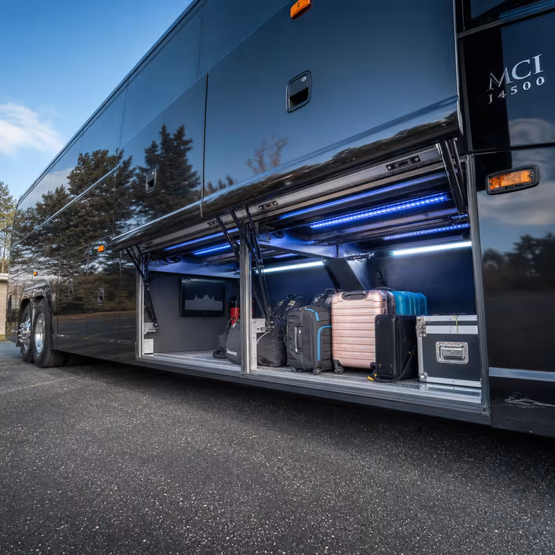 Party bus interior with wraparound leather seating and LED lighting in Dallas